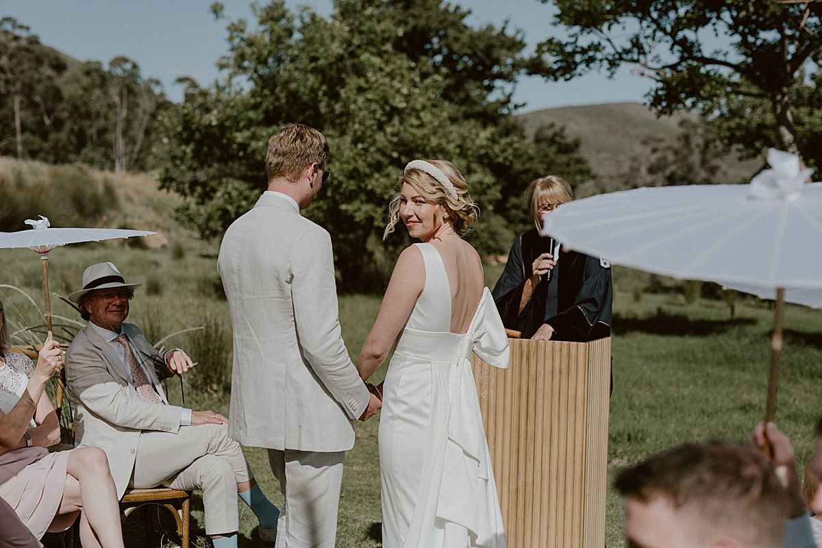 Bride and groom exchanging vows at Penhill Farm