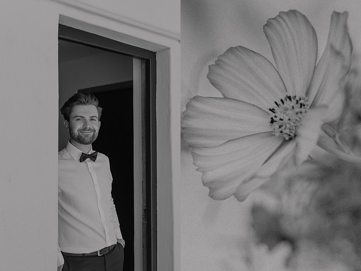 Bride and groom sharing a joyful moment at Weltevreden Estate, with elegant floral arrangements and Cape Dutch architecture.