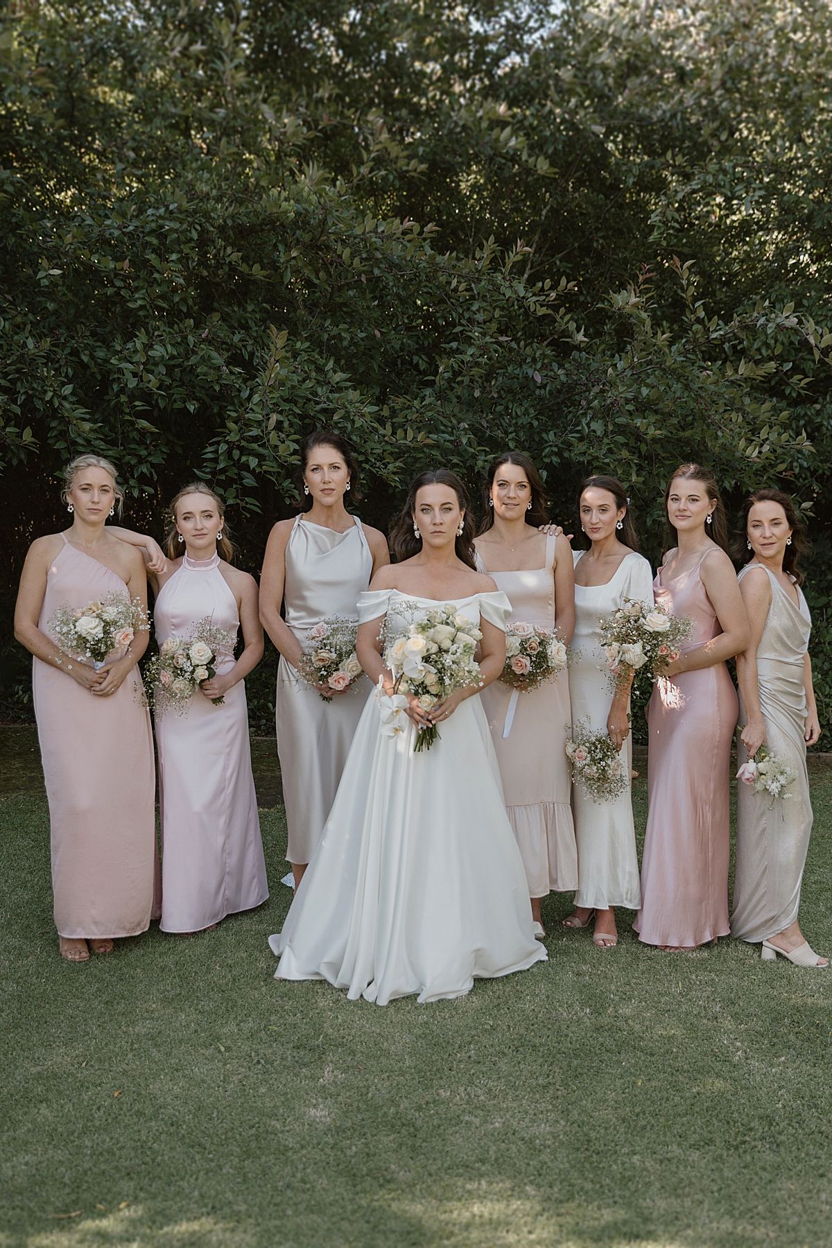 Bride and groom sharing a joyful moment at Weltevreden Estate, with elegant floral arrangements and Cape Dutch architecture.