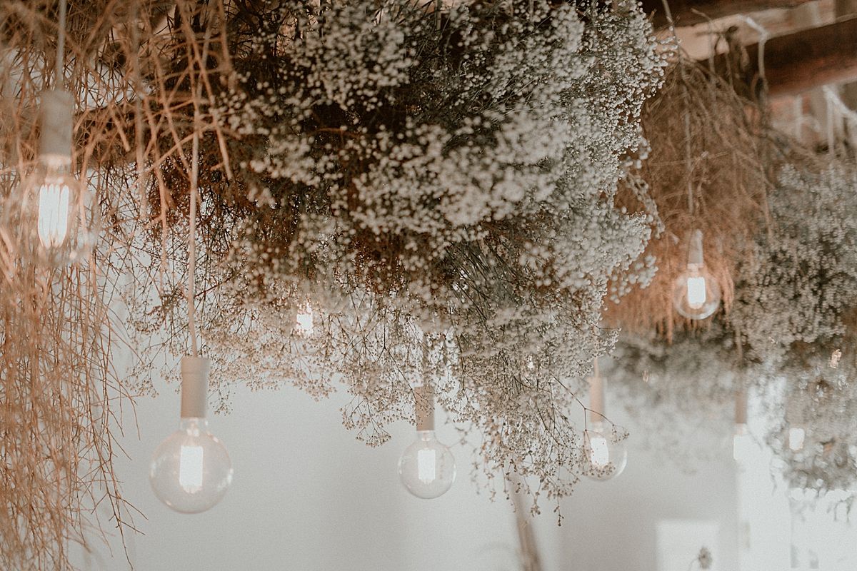 Decor details featuring floral arrangements by Kweek Studios