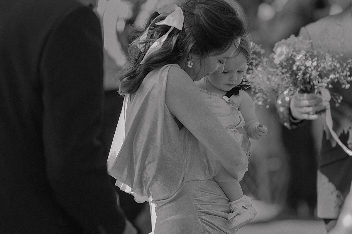 Bride and groom sharing a joyful moment at Weltevreden Estate, with elegant floral arrangements and Cape Dutch architecture.