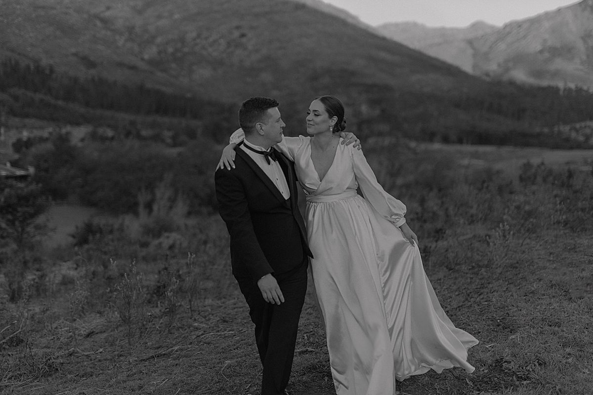 Bride and groom sharing a tender moment in golden sunlight at Cape Town wedding