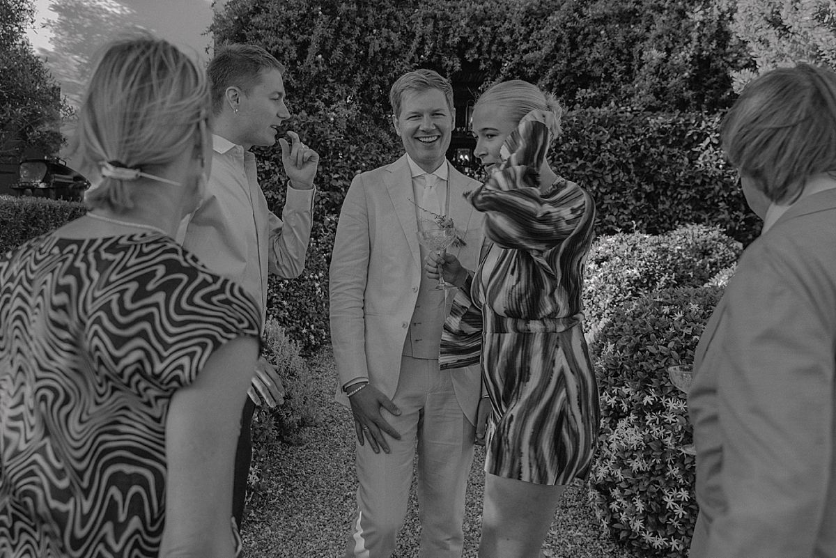 Wedding guests enjoying a relaxed celebration in Penhill Farm gardens