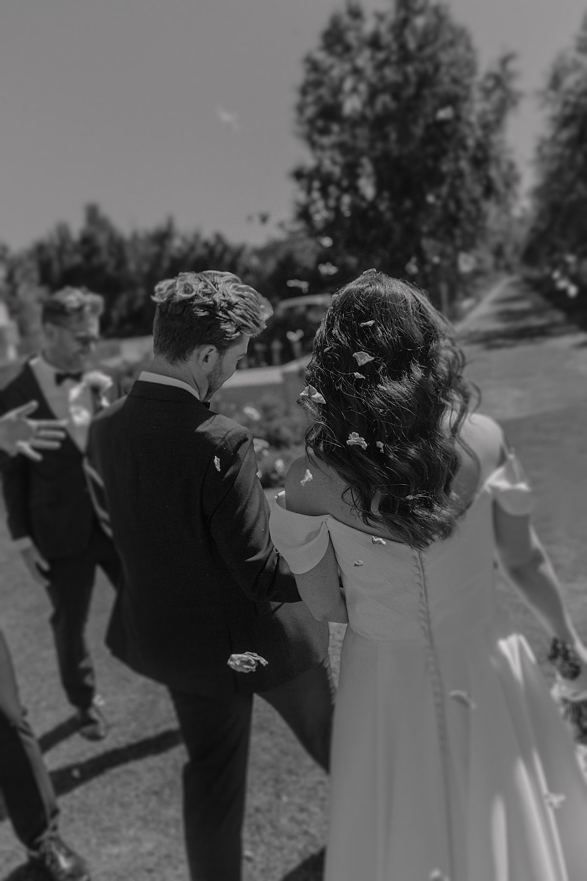 Bride and groom sharing a joyful moment at Weltevreden Estate, with elegant floral arrangements and Cape Dutch architecture.