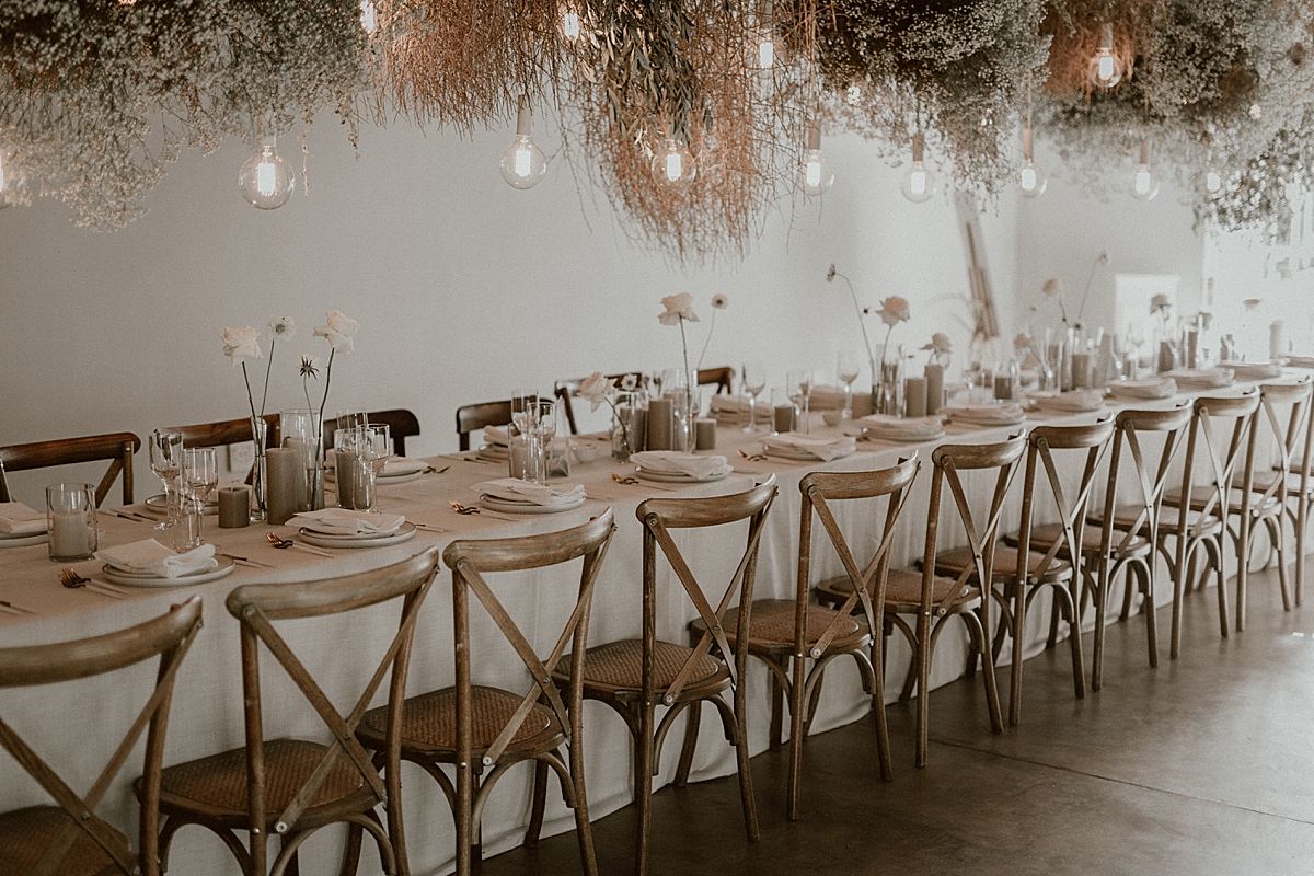 Decor details featuring floral arrangements by Kweek Studios