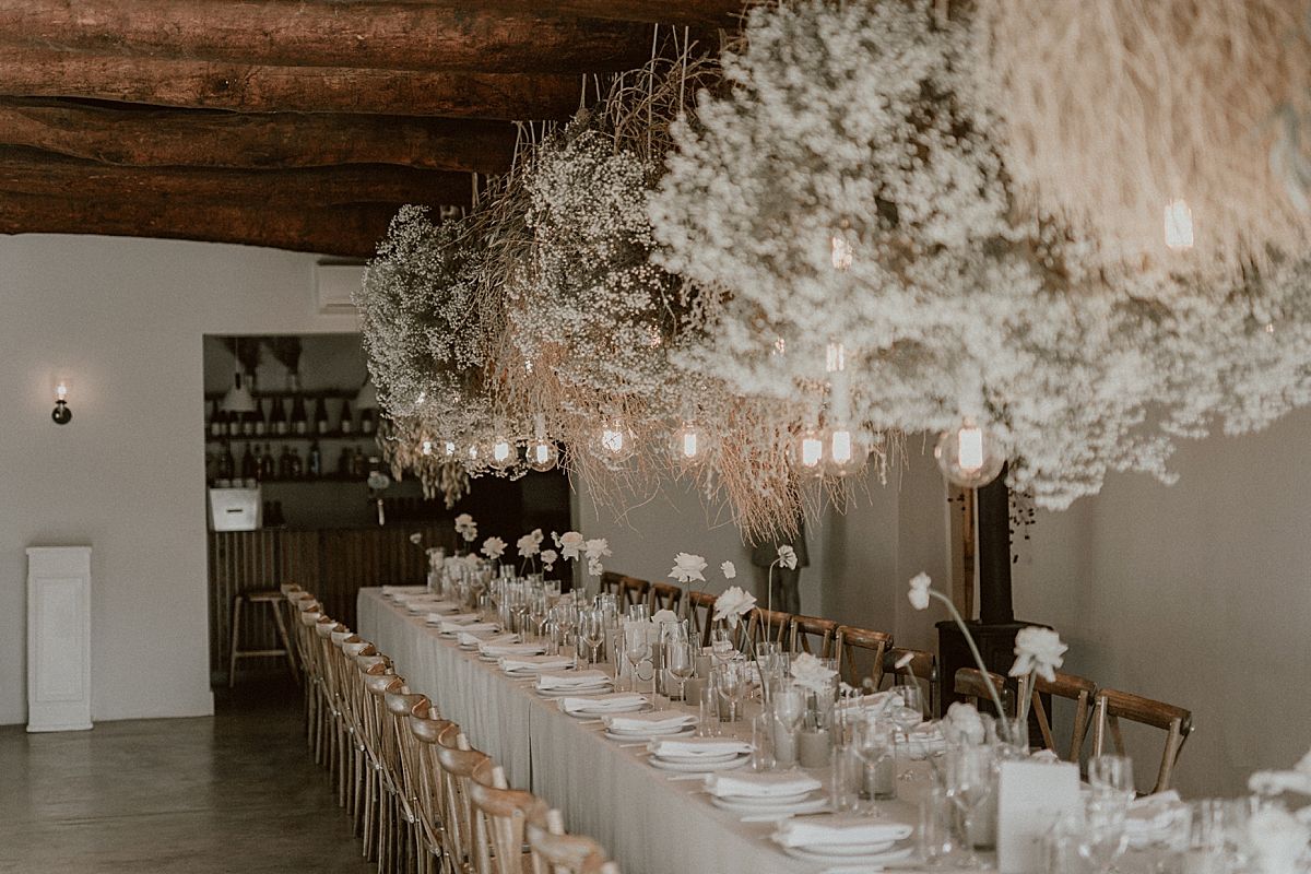 Decor details featuring floral arrangements by Kweek Studios