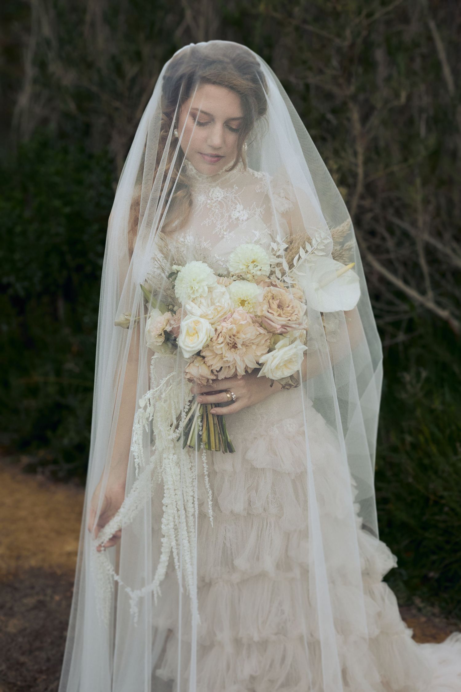 Alegant close-up bridal portrait highlighting delicate makeup and hairstyle