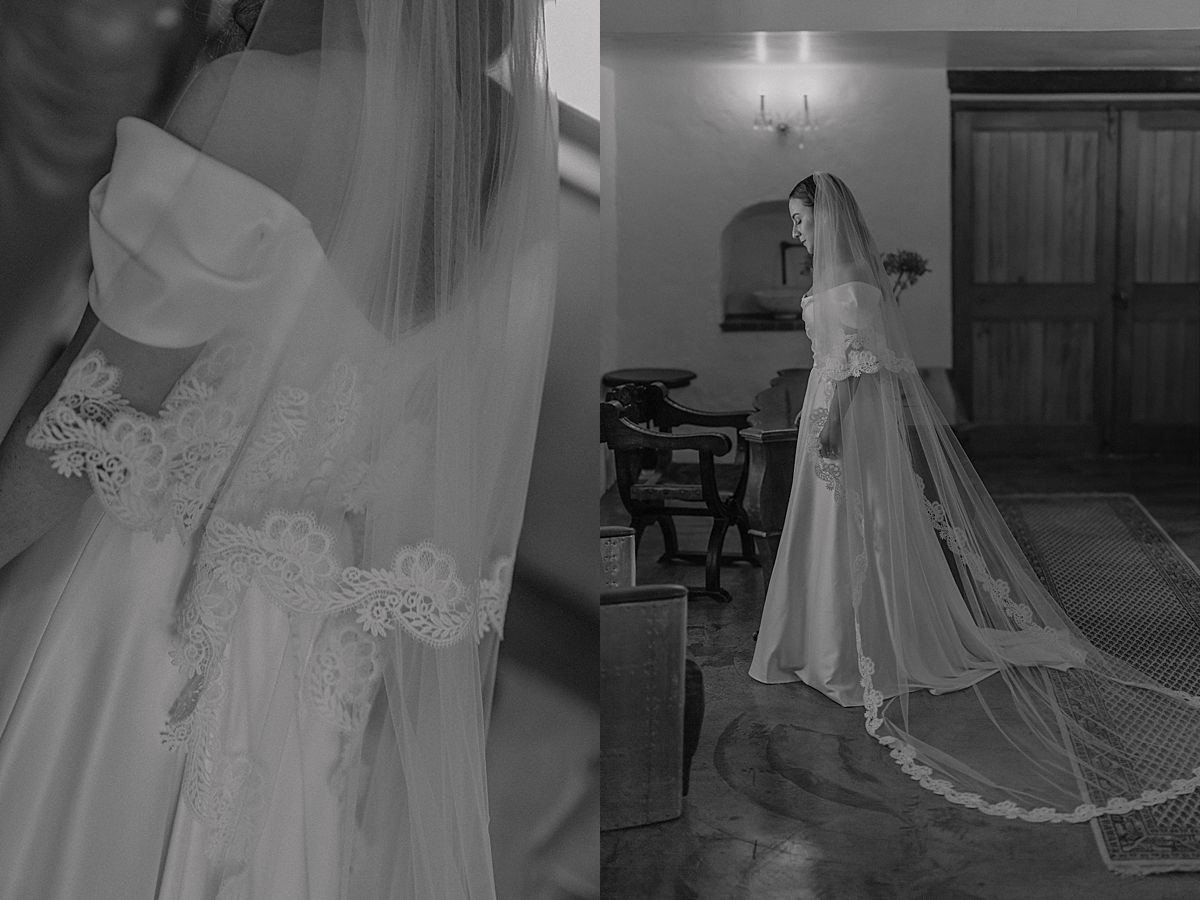Candid moment of bride and bridesmaids helping with dress and veil