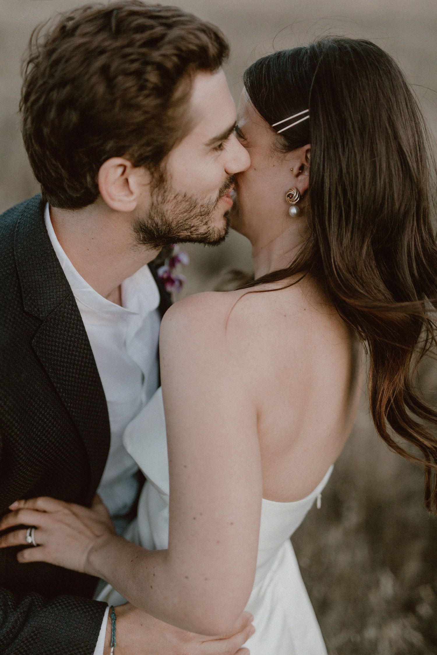 Bride and groom sharing a tender moment in golden sunlight at Cape Town wedding