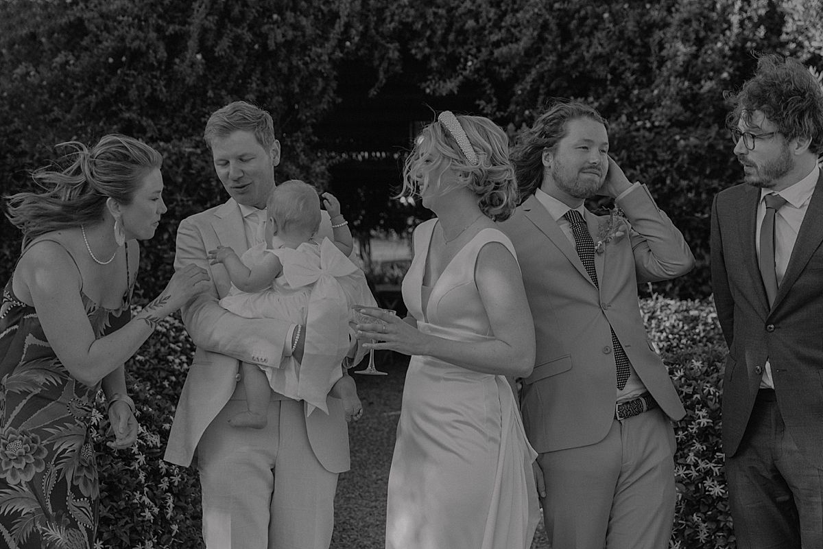 Wedding guests enjoying a relaxed celebration in Penhill Farm gardens
