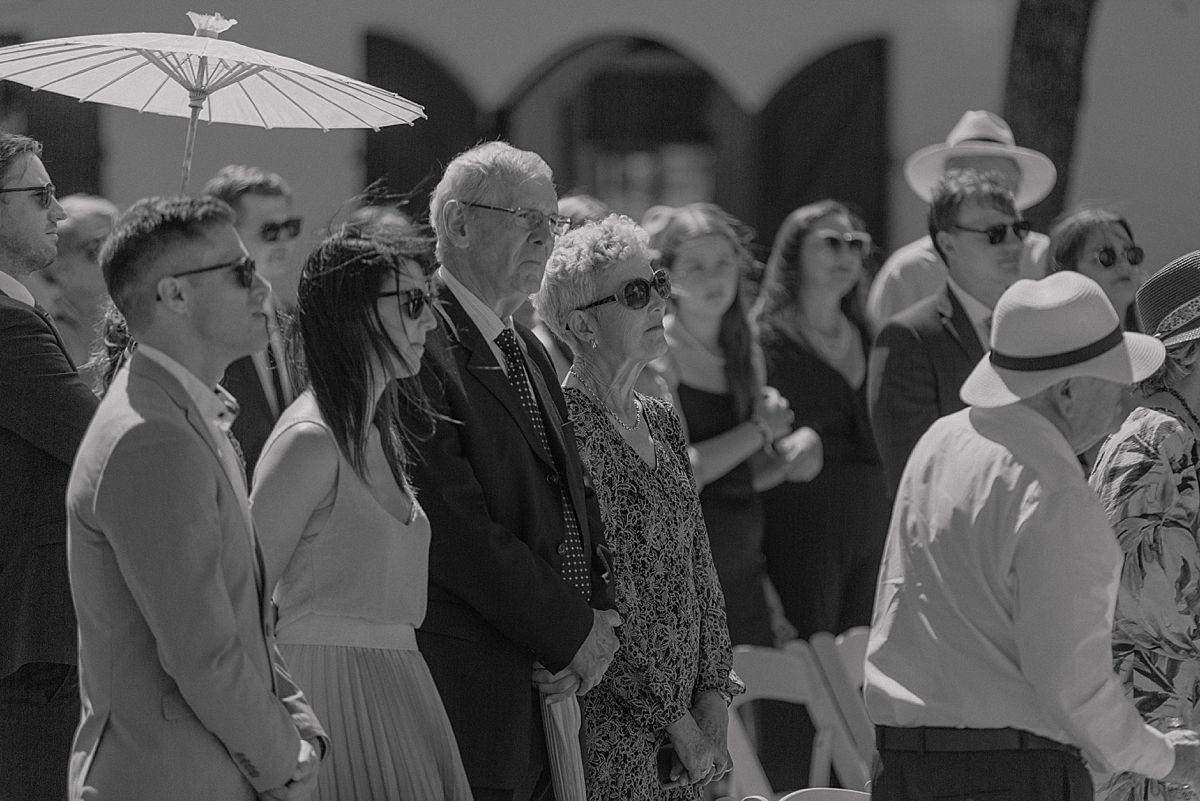 Bride and groom sharing a joyful moment at Weltevreden Estate, with elegant floral arrangements and Cape Dutch architecture.
