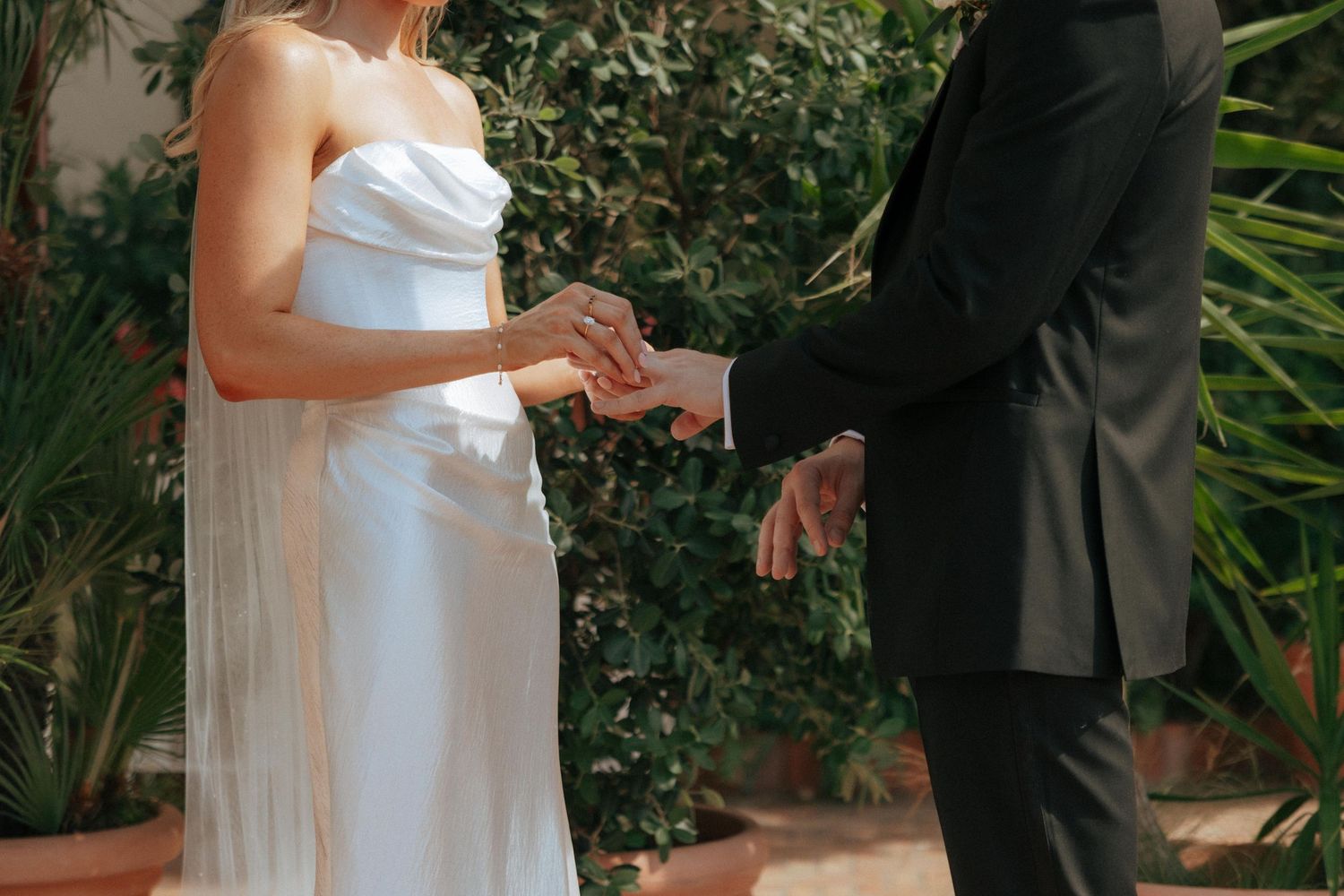 A series of connected images shows a romantic outdoor wedding ceremony with the couple exchanging vows beneath green foliage.