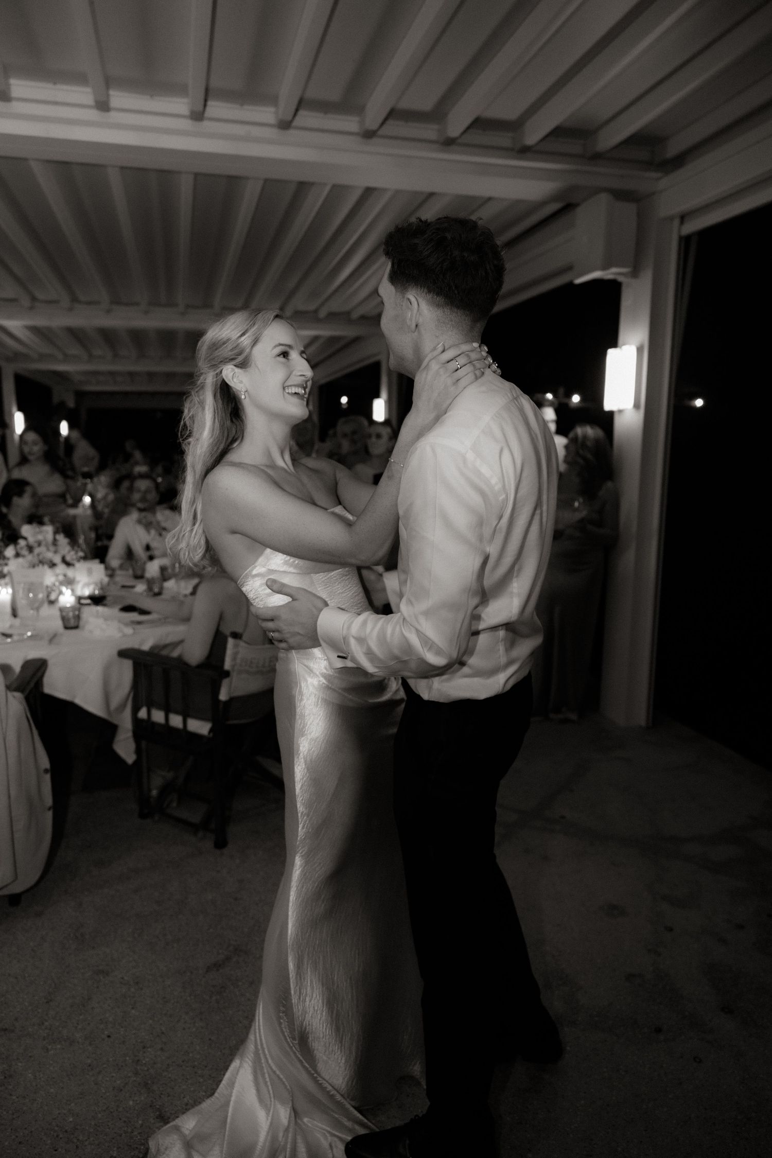 Black and white series of images showing a couple dancing gracefully at a formal event.