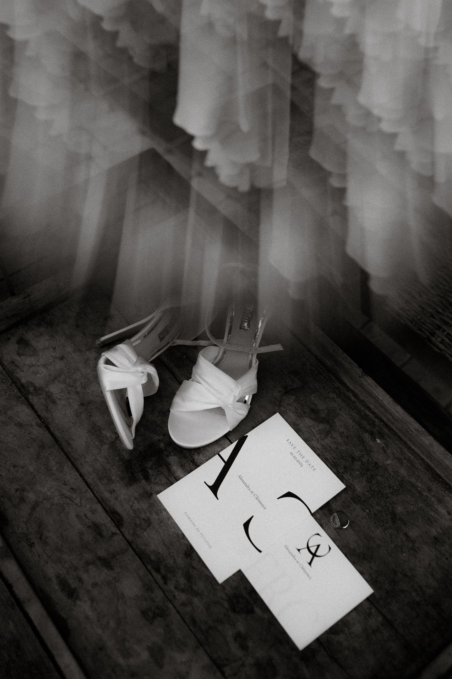 A series of black and white photographs showing a piece of paper being torn apart in dramatic lighting with shadows.