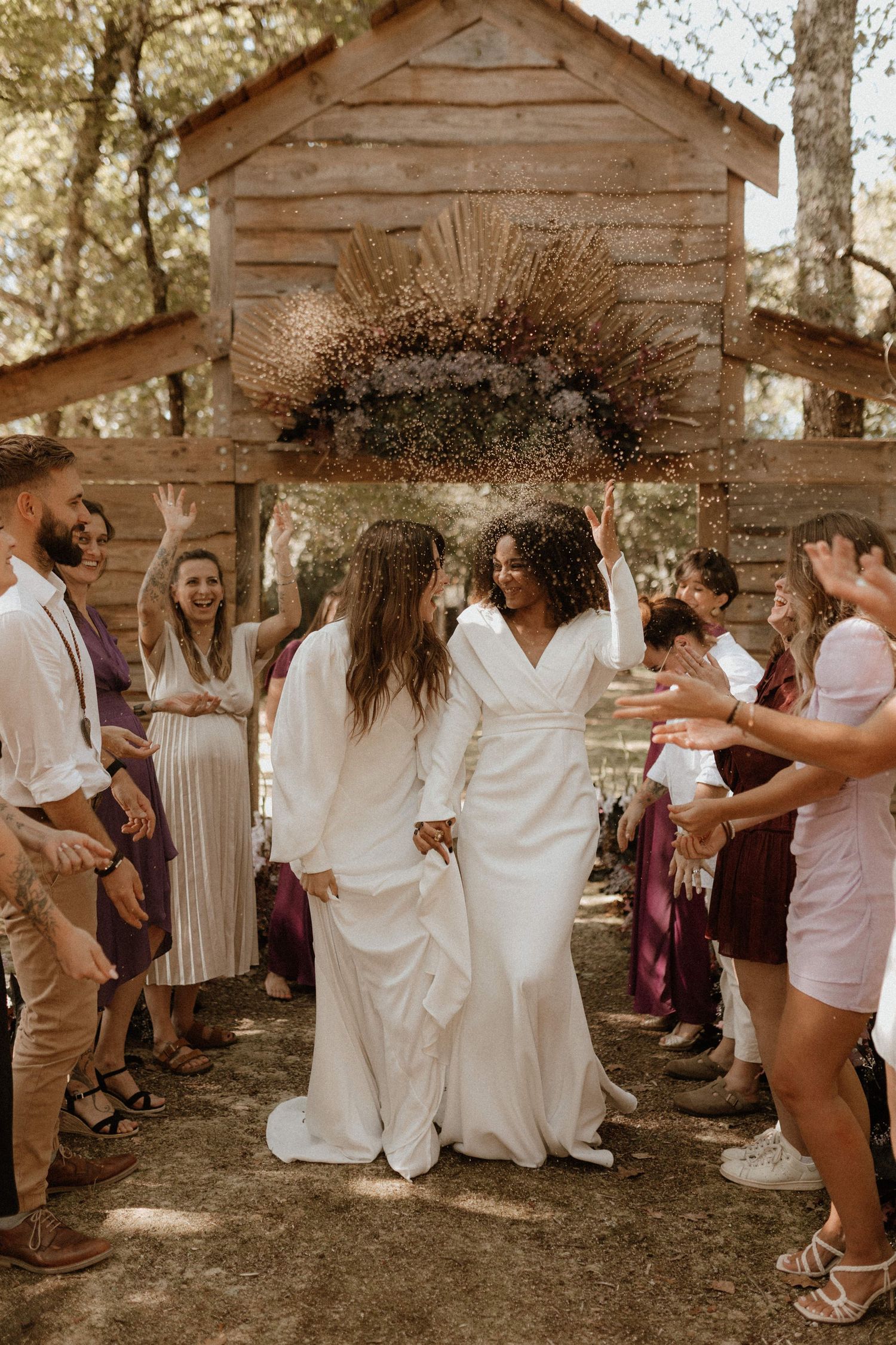 Sequence showing a fun dance party moment outdoors with guests in casual attire near rustic wooden sheds.
