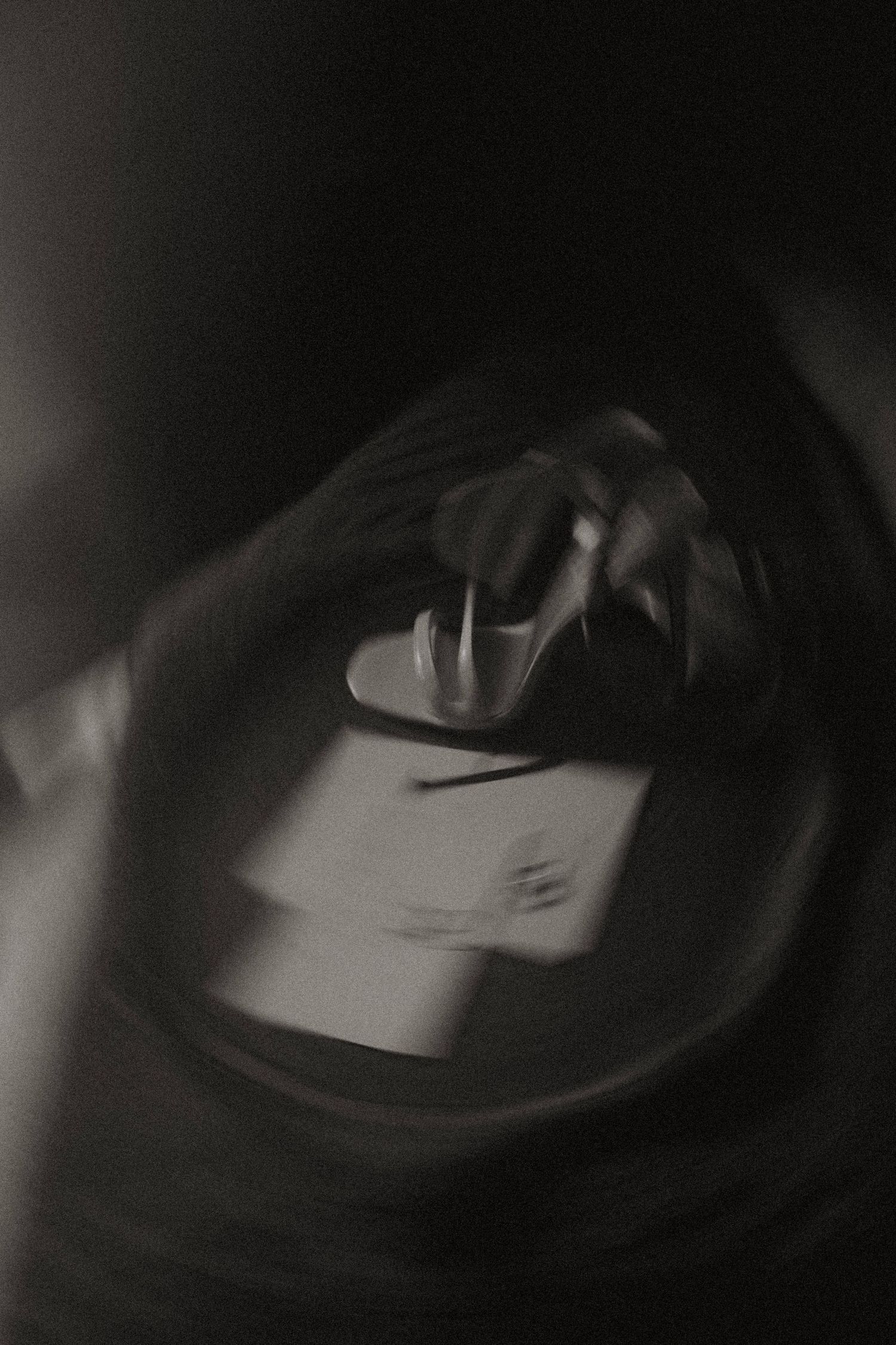 Time lapse images show moving turntable needle in dark dramatic lighting playing vinyl record.
