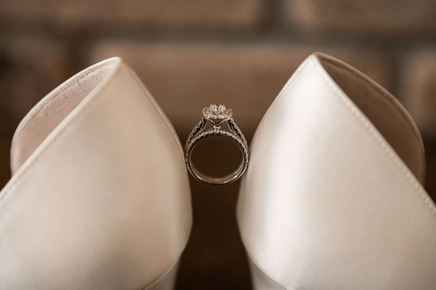 Close-up view of delicate wedding tiaras and crowns in soft focus.