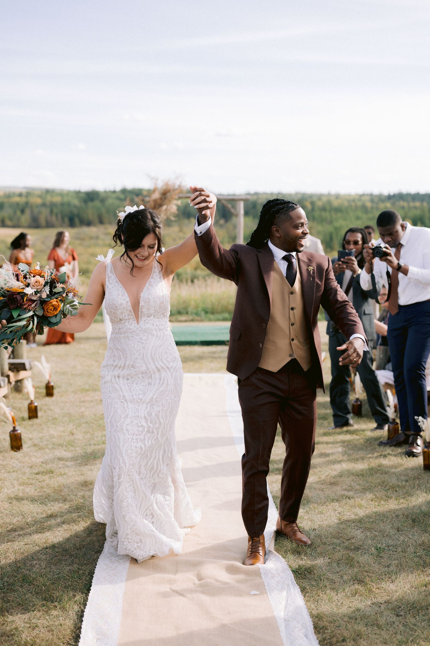 A joyful wedding celebration sequence showing couples walking down an outdoor aisle.