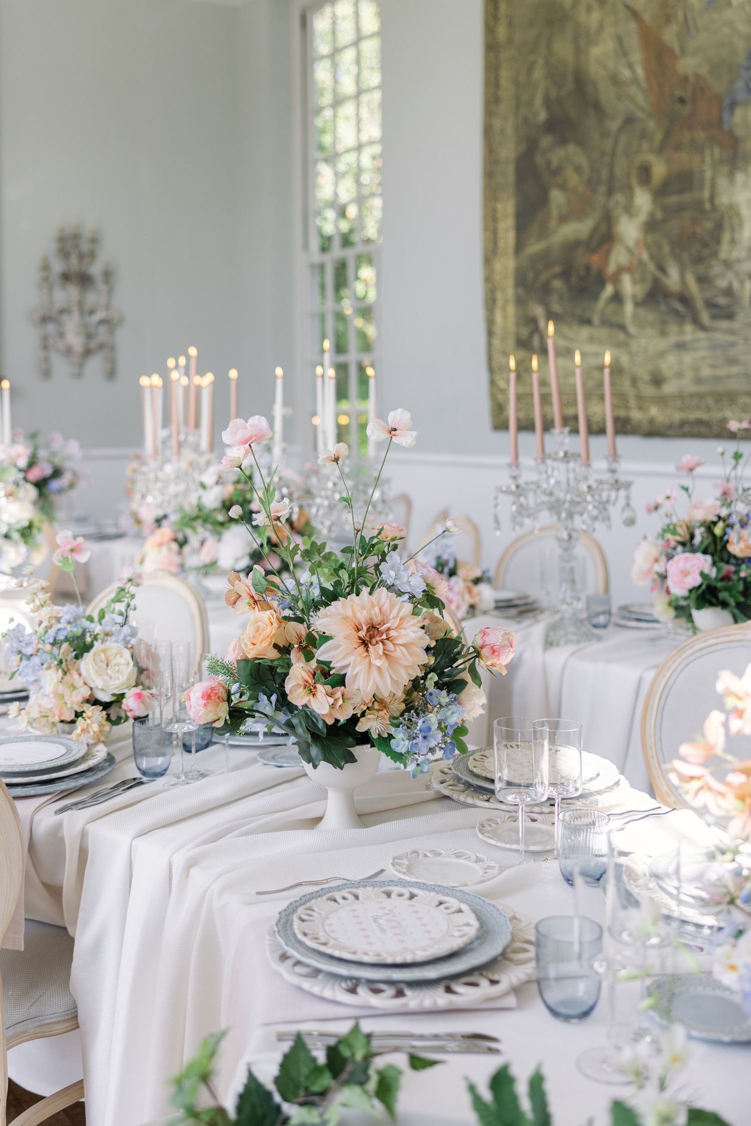 elegant floral wedding tablescape with pastel flowers, vintage plates and crystal glassware - captured by Miriam Caterina Wahl
