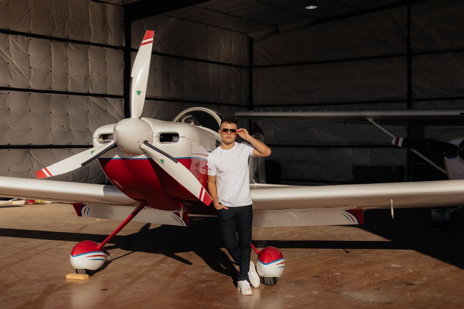 Senior personality photos at Aero Valley Airport in Roanoke, Texas taken by Kaitlyn Fleming Photography.