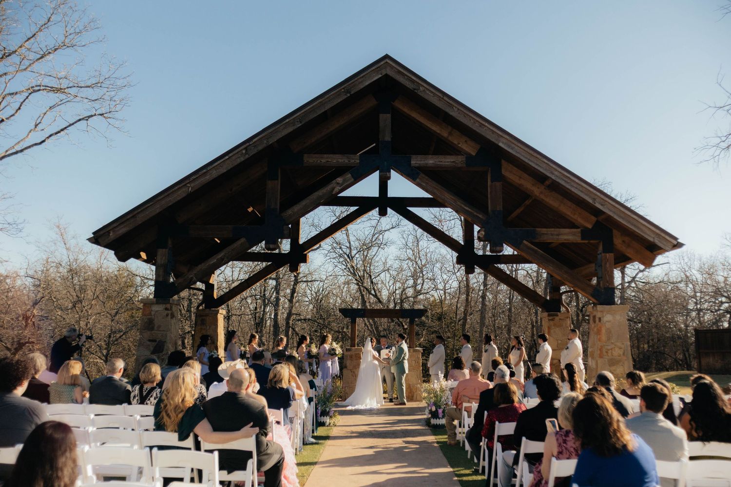 Wedding ceremony photos taken by Kaitlyn Fleming Photography at The Springs Wedding Venue in Aubrey, TX.