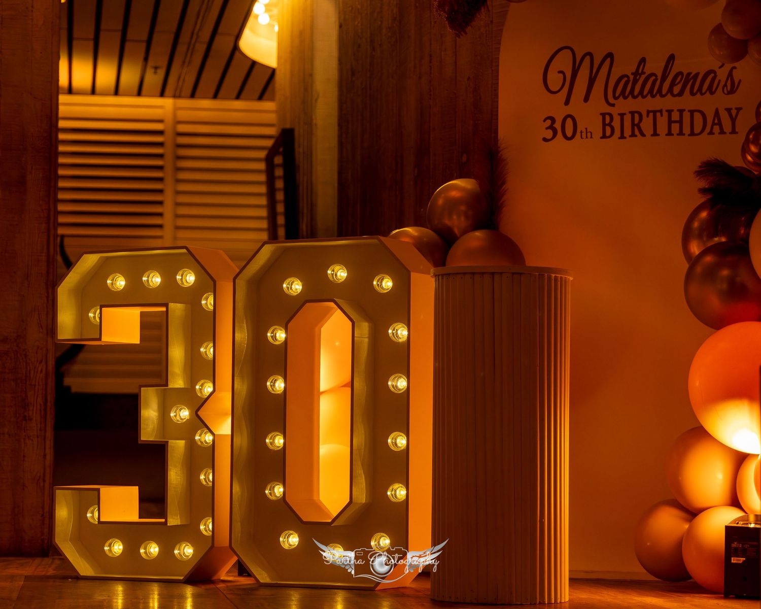 Warm ambiance with illuminated number lights spelling out 30.