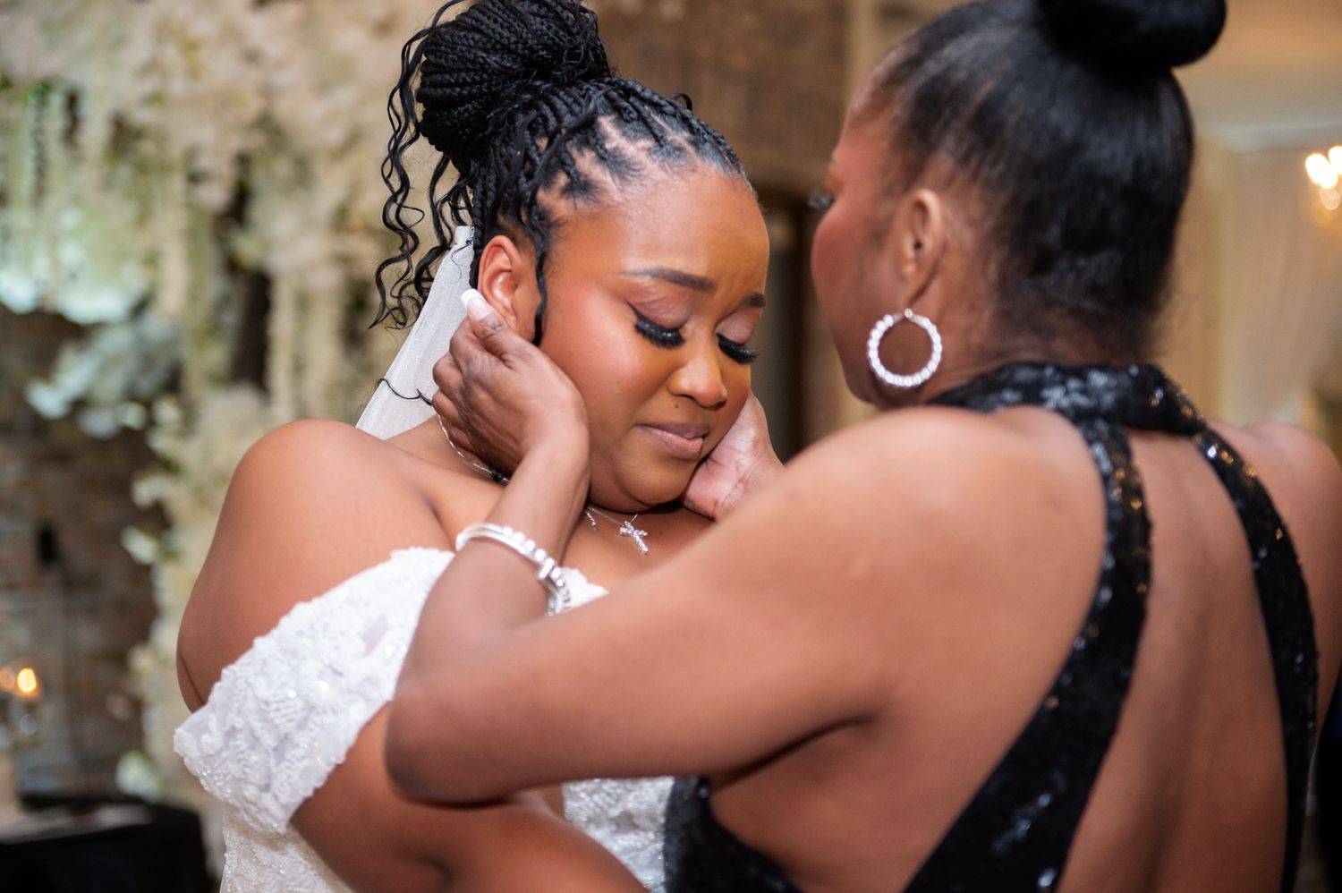 Bride getting ready with makeup artist in luxury suite