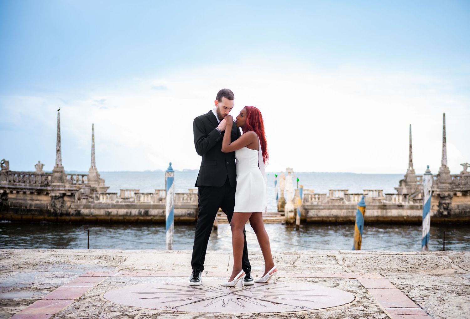 Engagement moment under banyan trees at Vizcaya, photographed by experienced Florida wedding photographers.
