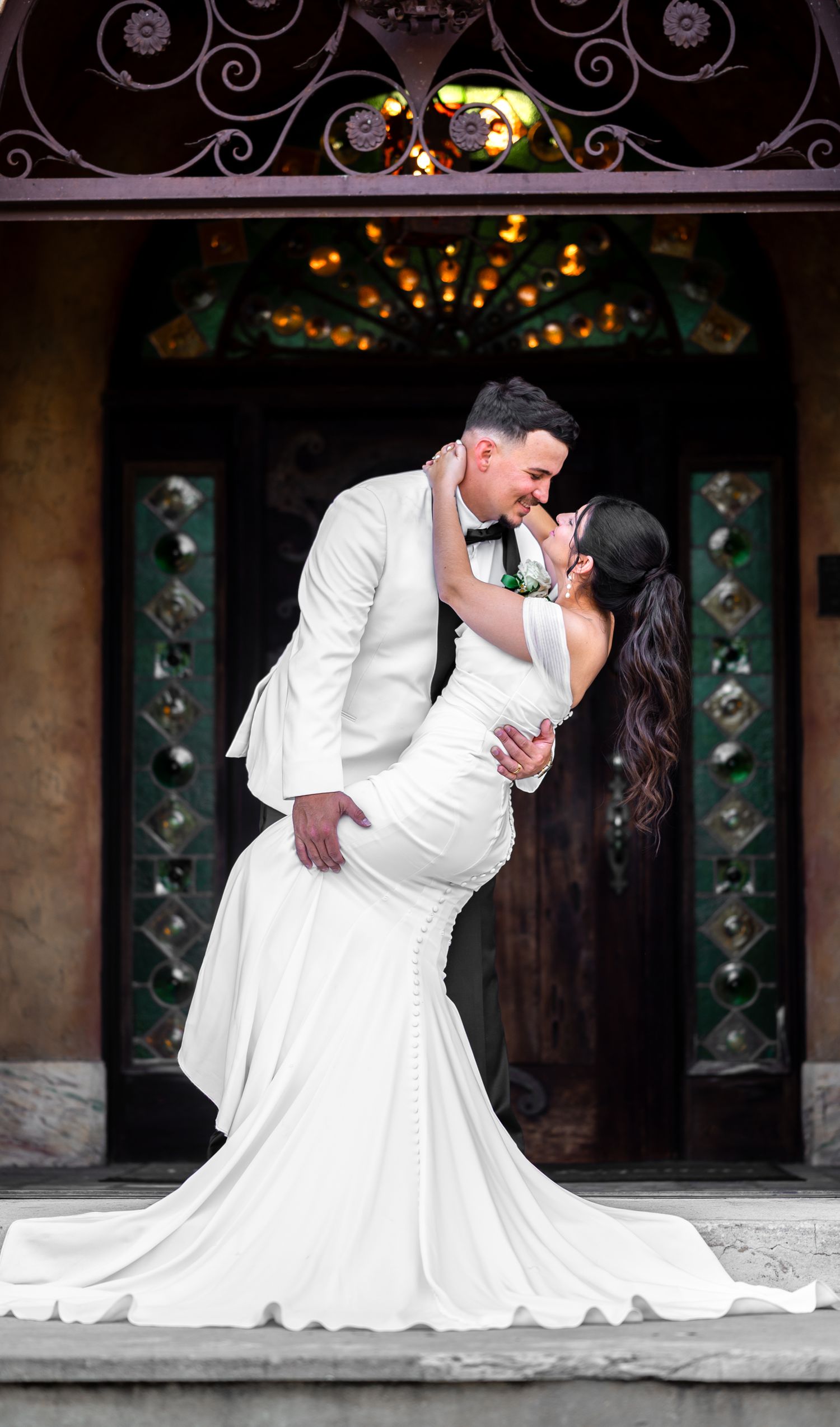 Bridal party portraits in the manicured garden at Howey Mansion, taken by top Central Florida wedding photographers.