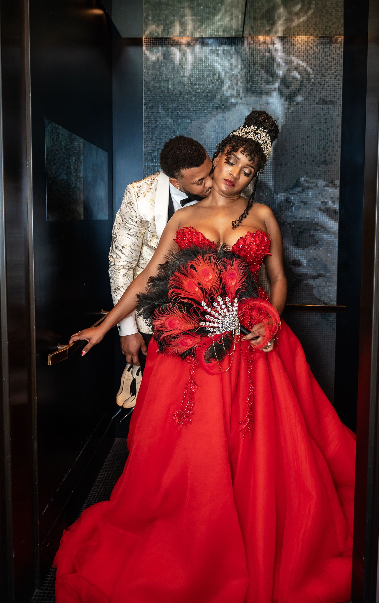 Breakers wedding photographers traveled to New Orleans to capture this couple in an elevator kissing before their destination elopement