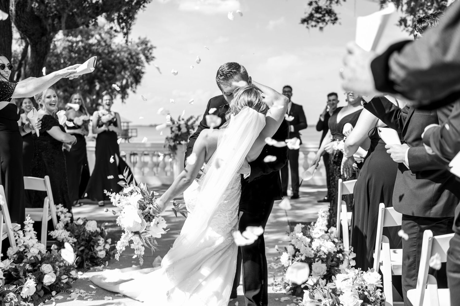 Bride and groom silhouetted by evening lanterns