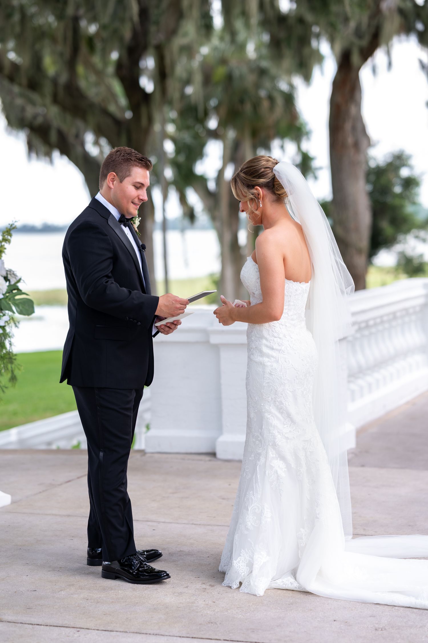 Bride walking down aisle with emotional guests in background