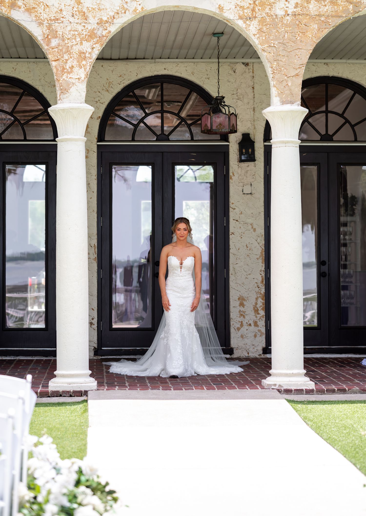 Groom wiping away bride’s tears during emotional first look