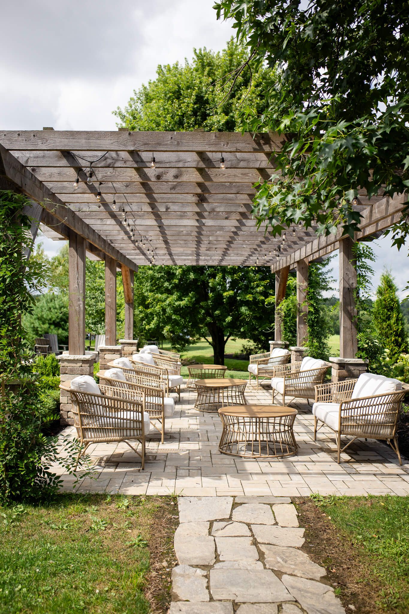 brick patio bathed in sunlight with luxury wicker furniture