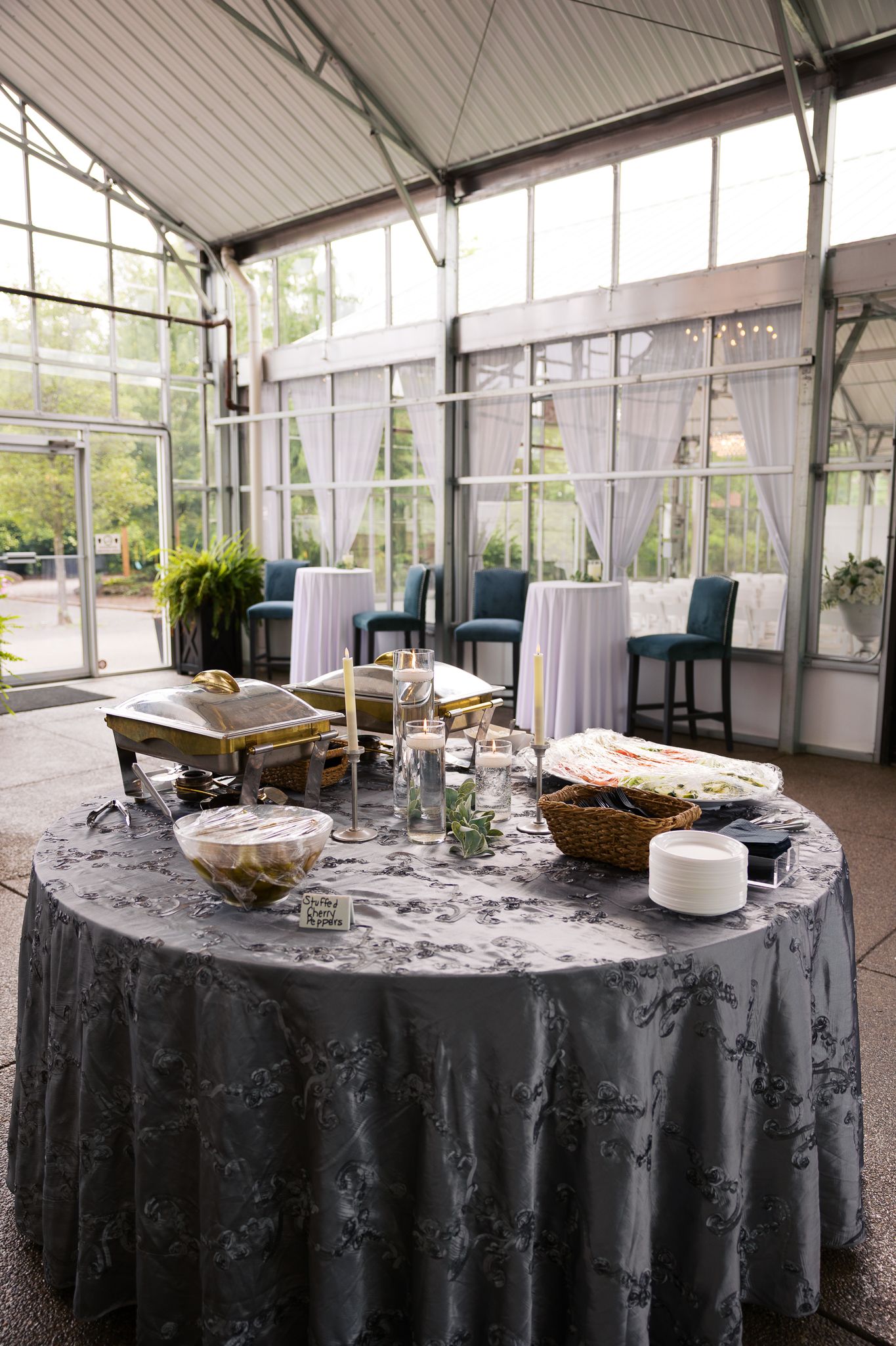 catering setup for cocktail hour in beautiful natural light hall