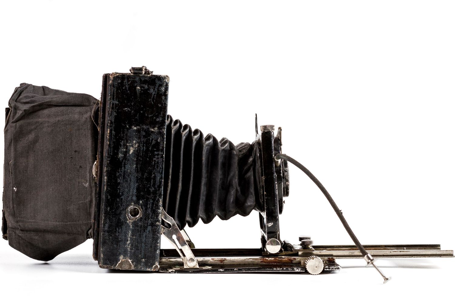 Vintage large format bellows camera on white background.