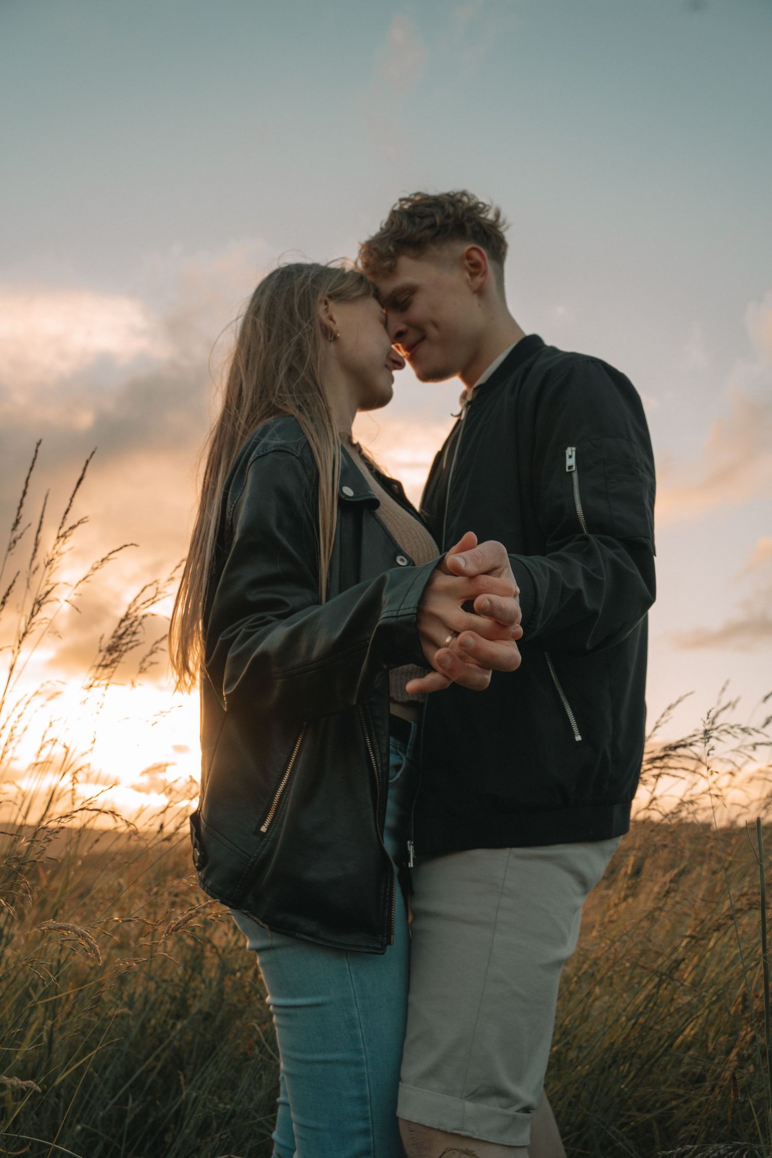 Couple walking through the Scottish Highlands during golden hour