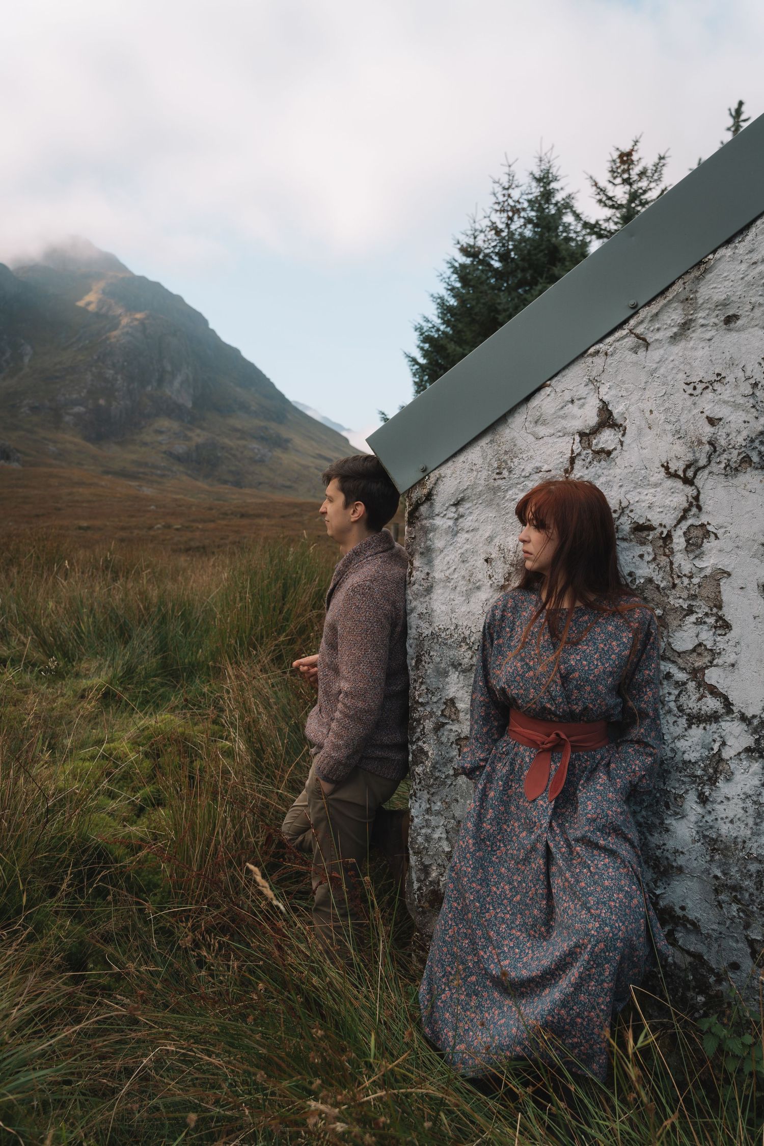 Adventure couple shoot surrounded by dramatic mountain peaks