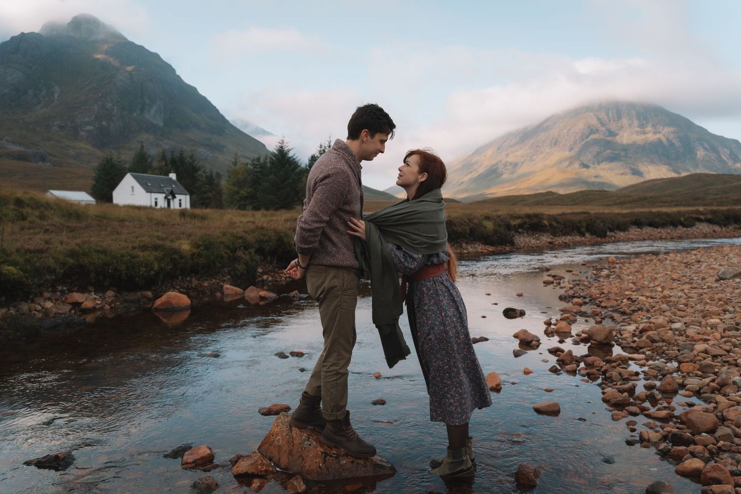 Adventure couple shoot surrounded by dramatic mountain peaks