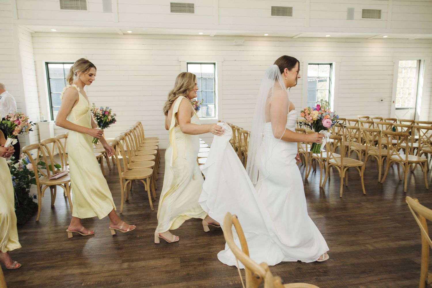 A candid series of wedding photos shows two people kissing and playfully dancing together in a rustic venue.
