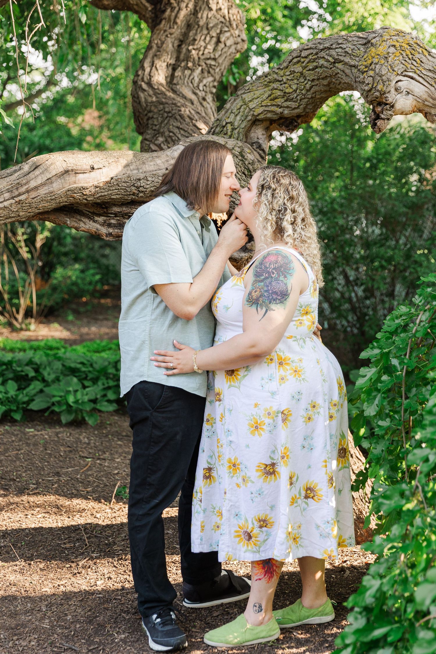 Romantic engagement portraits in garden setting at Lilacia Park Lombard IL