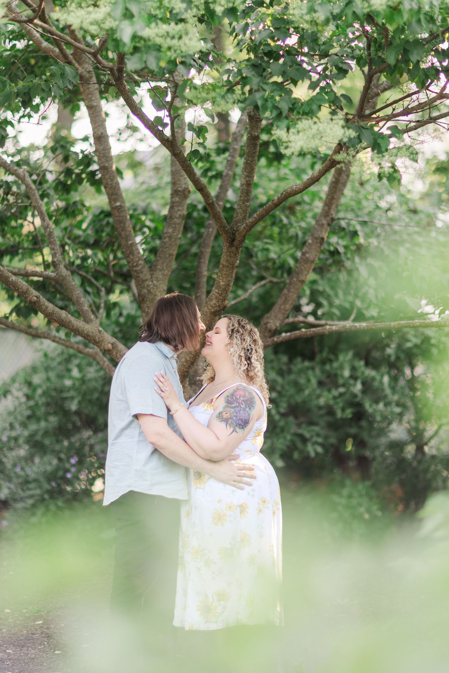 Engagement photo of couple at Lilacia Park Lombard IL at sunset