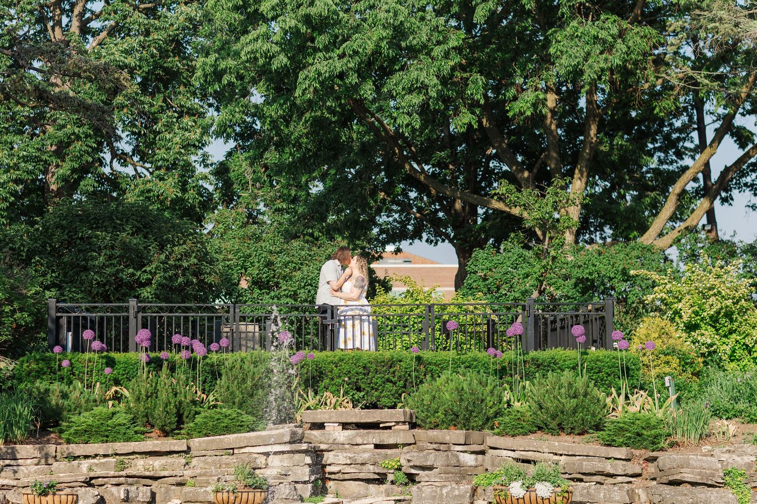 Engagement photo of couple at Lilacia Park Lombard IL at sunset