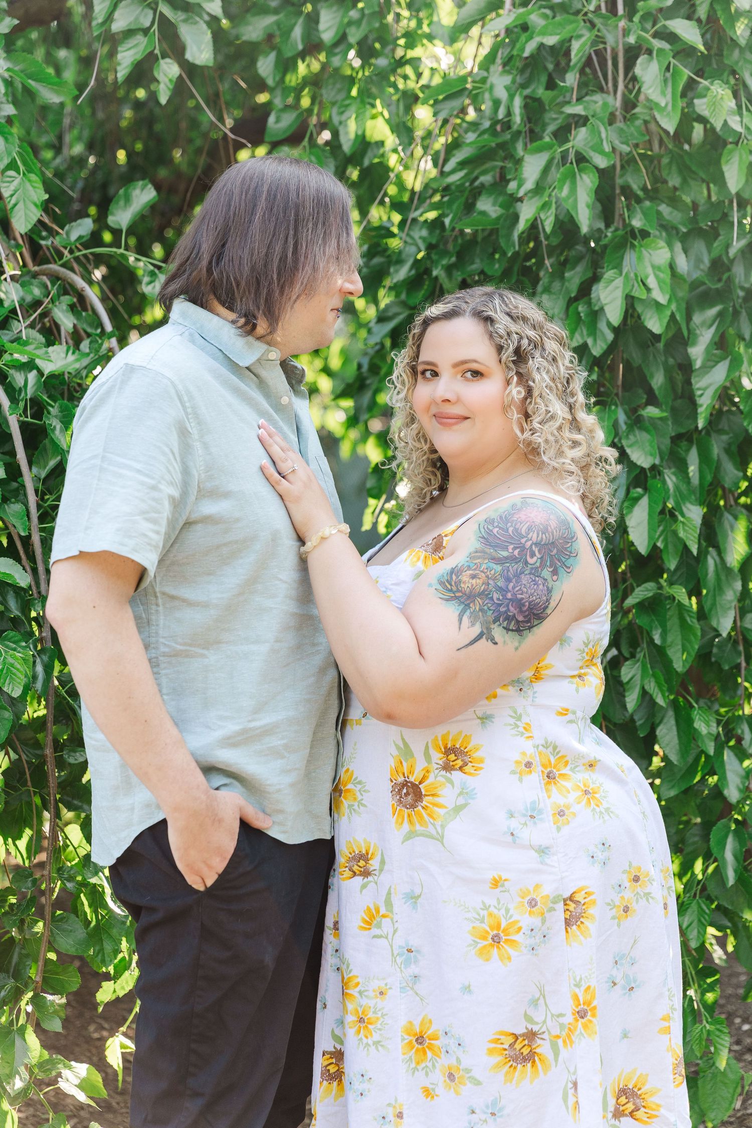 Engagement photo of couple at Lilacia Park Lombard IL at sunset