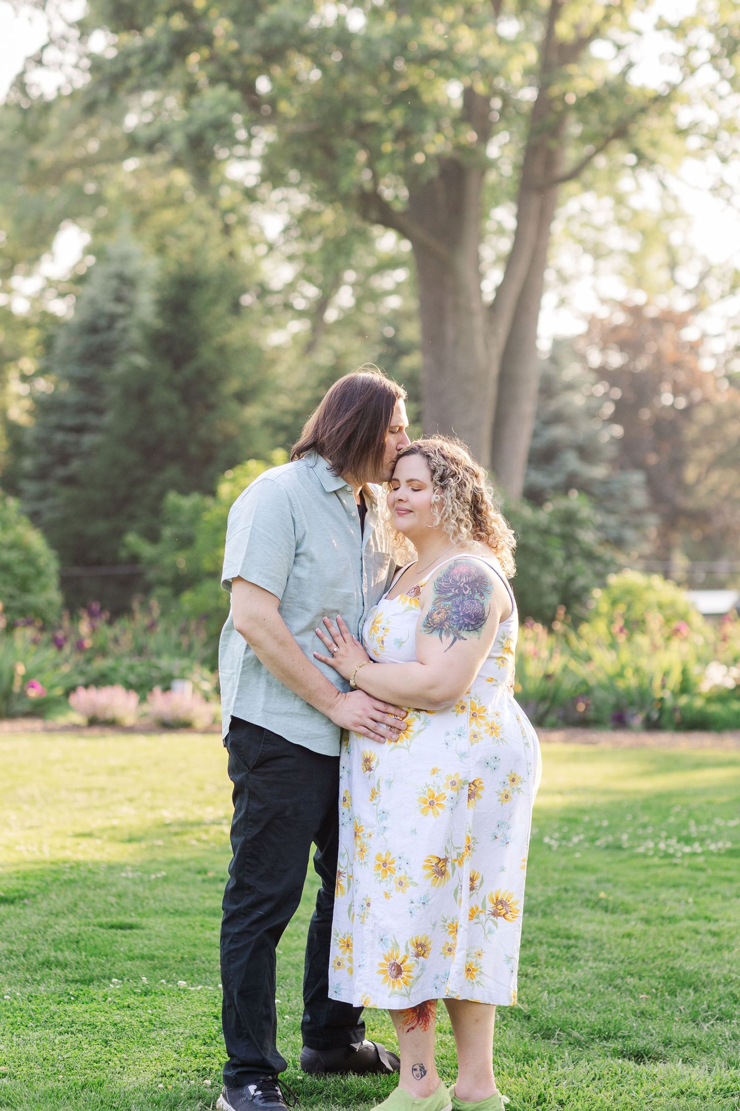 Engagement photo of couple at Lilacia Park Lombard IL at sunset