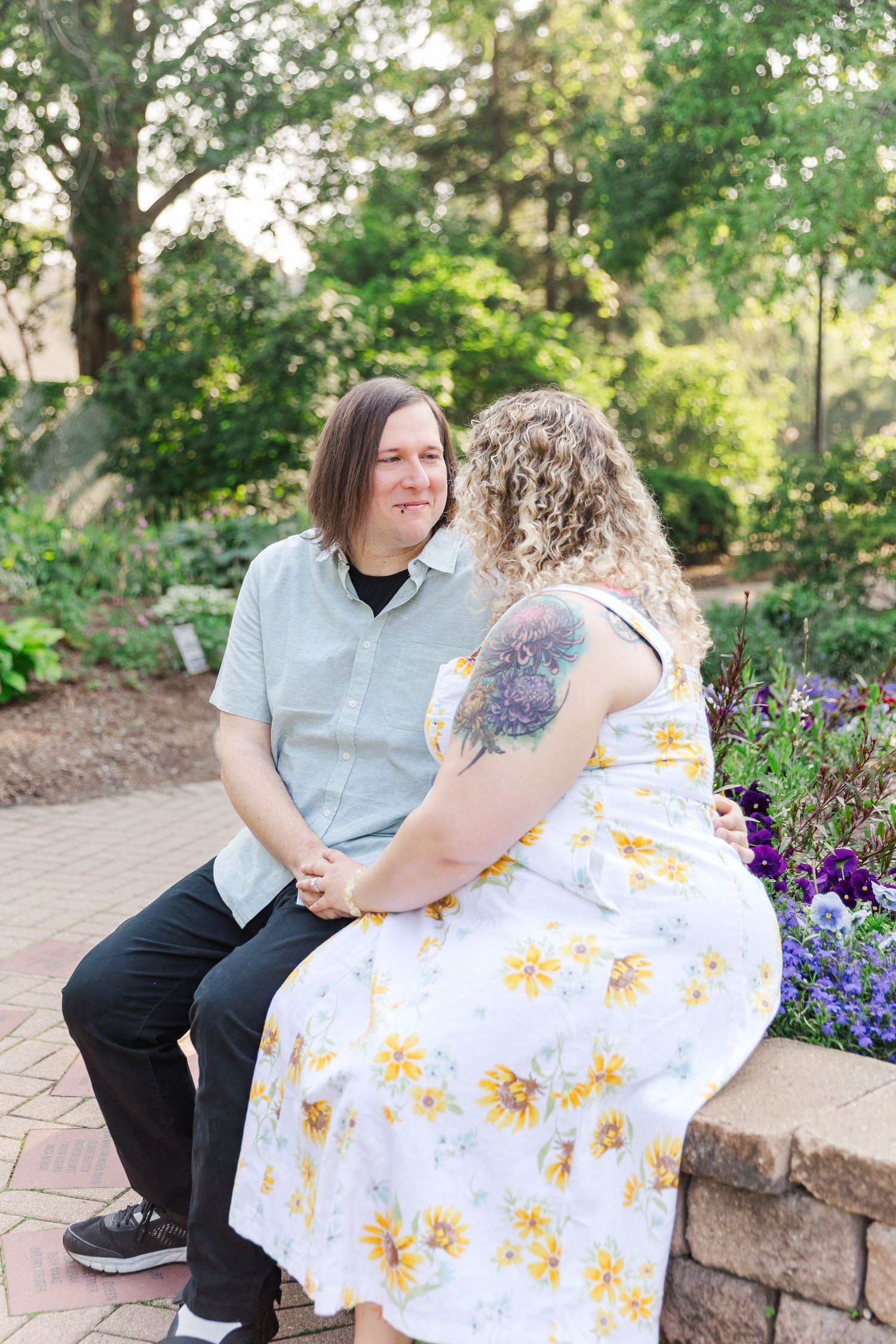 Romantic engagement portraits in garden setting at Lilacia Park Lombard IL
