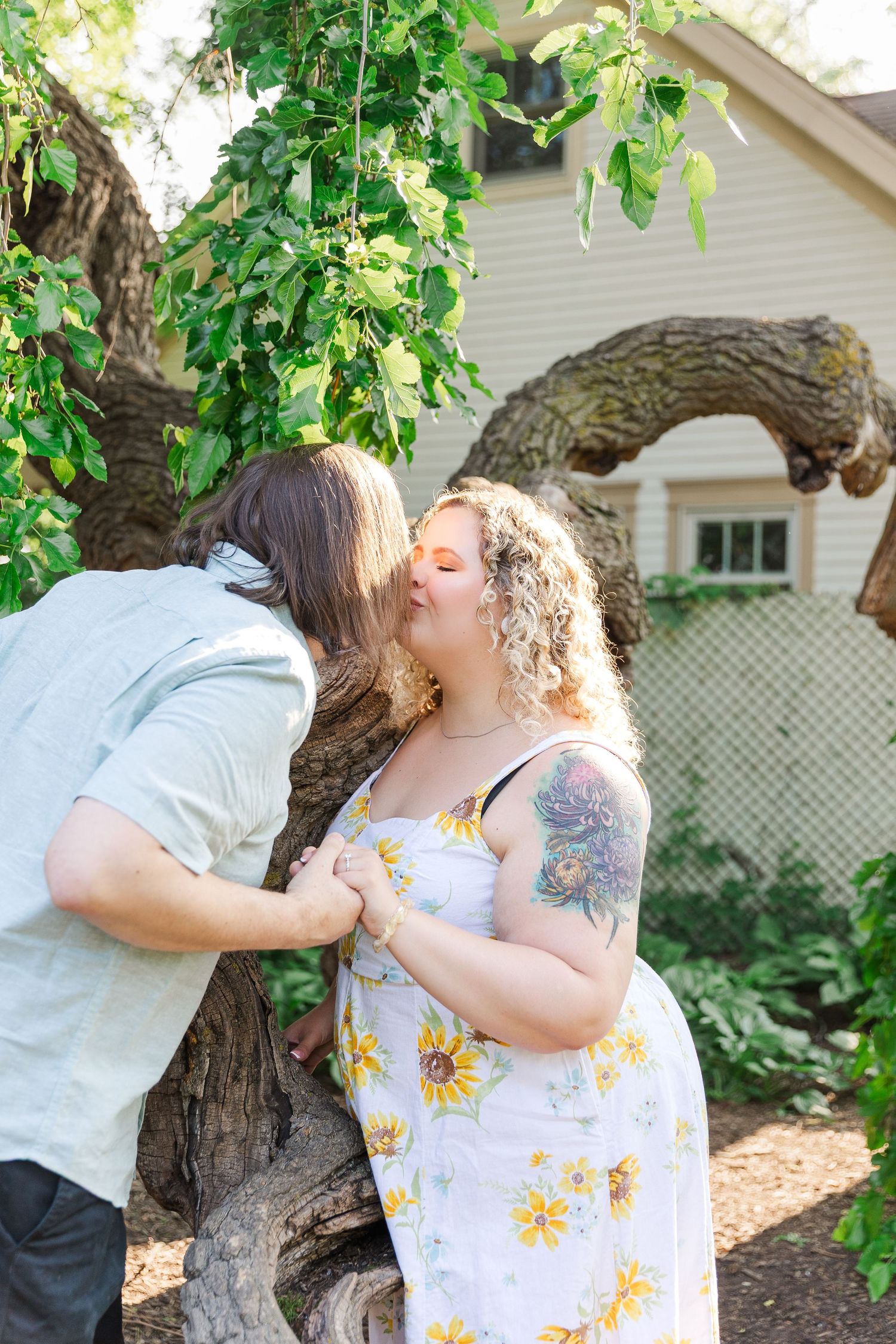 Engagement photo of couple at Lilacia Park Lombard IL at sunset