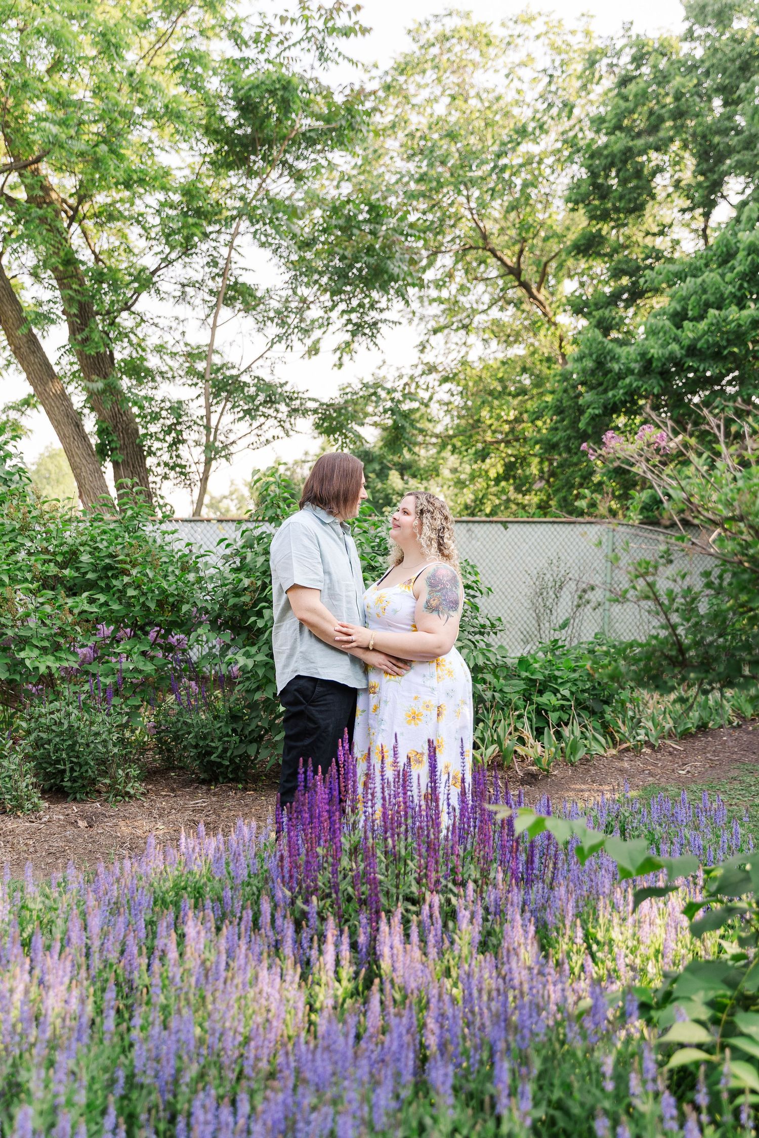 Romantic engagement portraits in garden setting at Lilacia Park Lombard IL