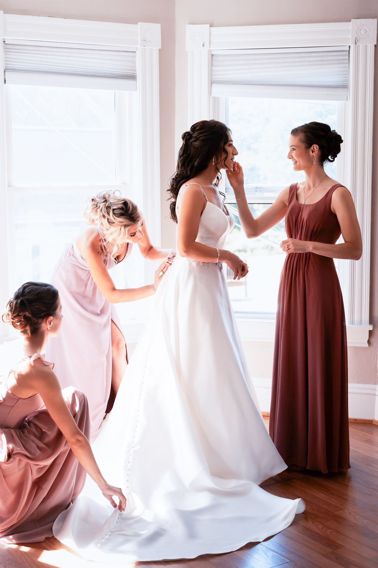 Bridesmaids laughing during prep in Lehigh Valley PA, documentary-style candid wedding image