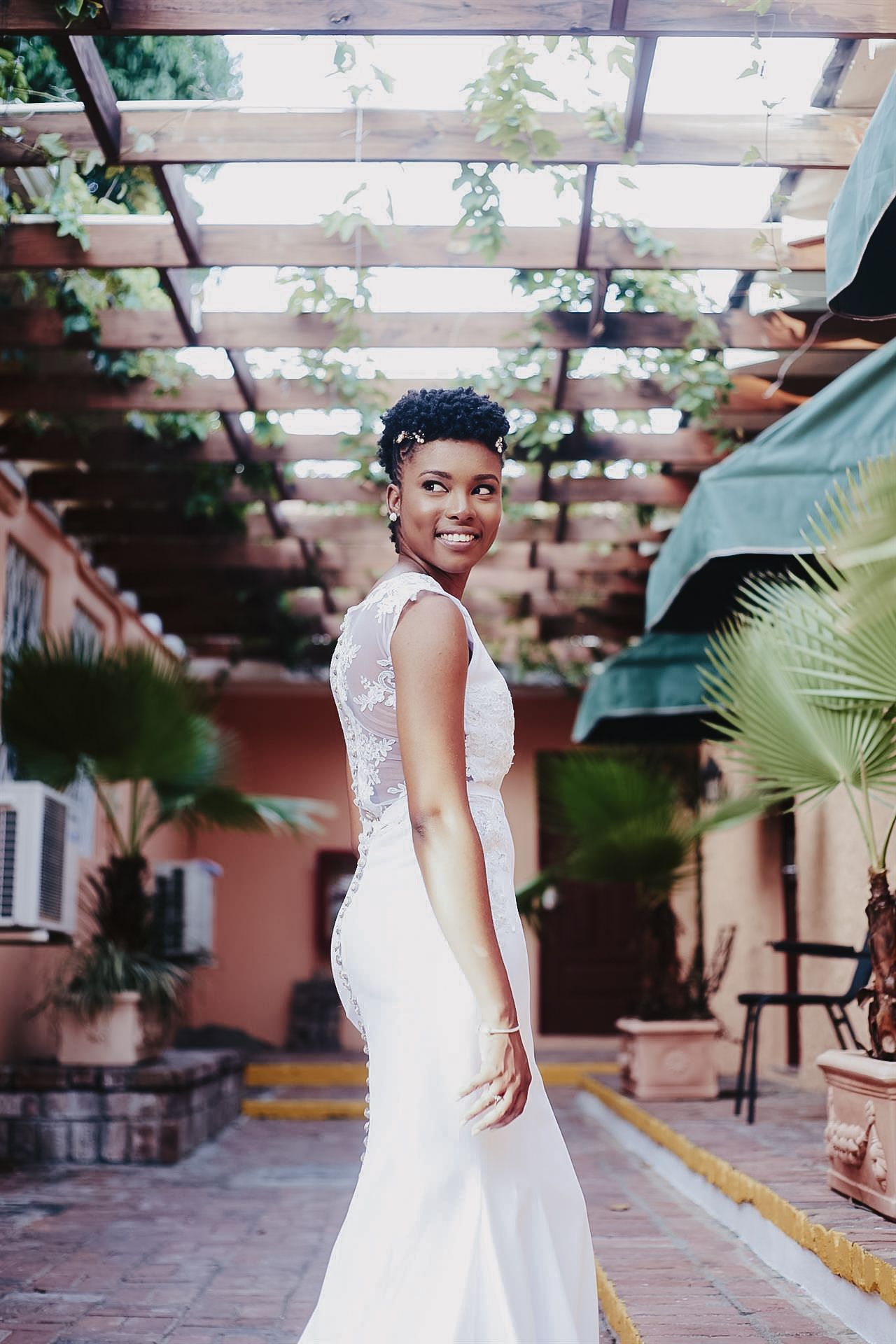 Elegant black bridal portrait featuring muted green floral accents in Huntsville, AL — a timeless and sophisticated image captured with a br